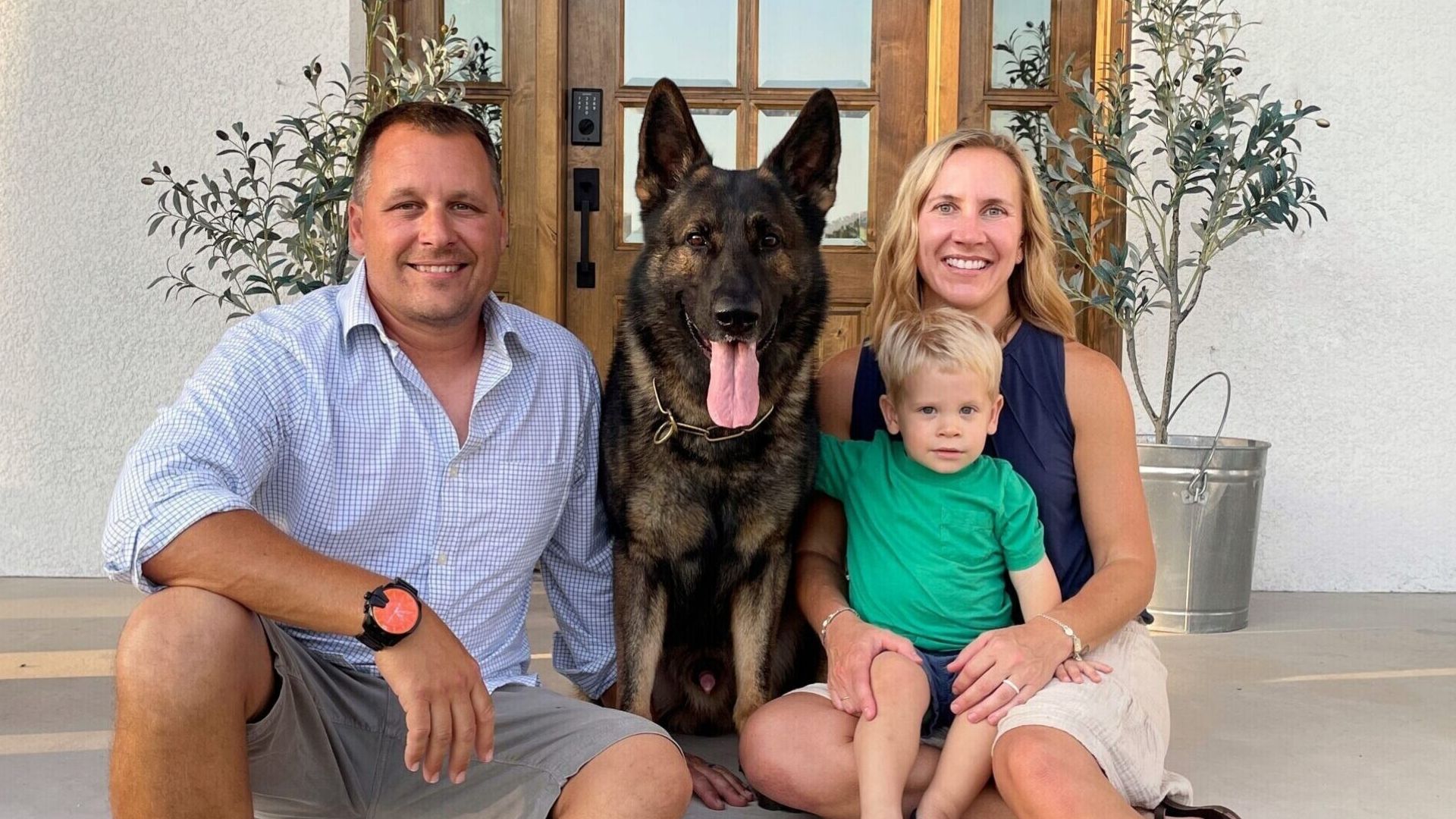 Trained dog with a happy Tampa family